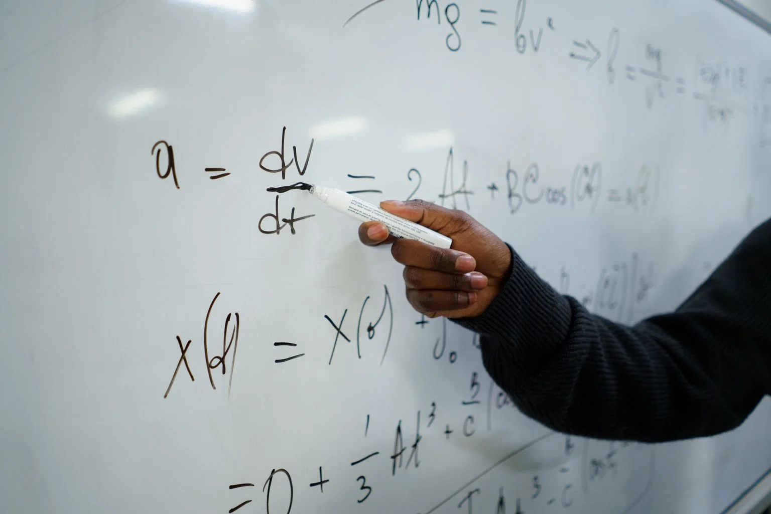 An A-Level student discussing maths with a tutor